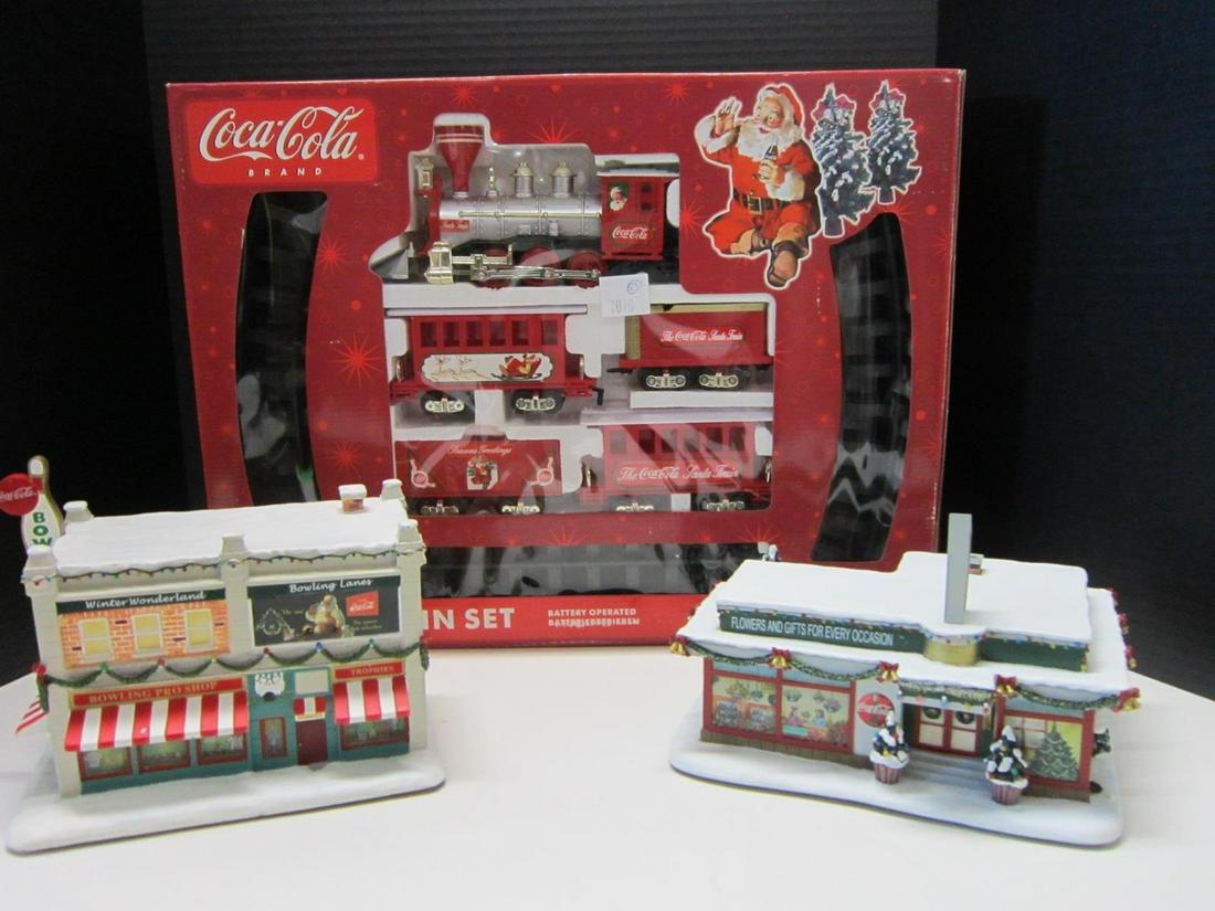 Coca-Cola Holiday Village & Train Set: Coca-Cola Holiday Village and Train Set, all in styrofoam or box including: two Hawthorne Village, Holiday Village porcelain pieces, "Winter Wonderland Bowling Lanes, #A7341 and Holiday Village Florid