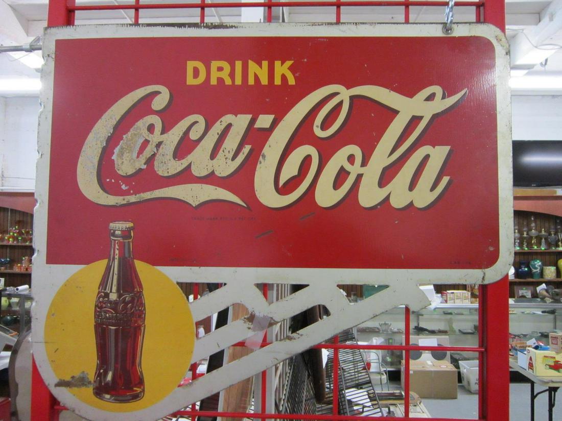 "Drink Coca-Cola" Sign: "Drink Coca-Cola" Sign, Deco style, double sided wall mount, lithographed heavy gauge metal with open work bracket form bottom, "A.A.W.2-45", 24" x 20 1/2". CONDITION: Scratches, numerous areas of pai