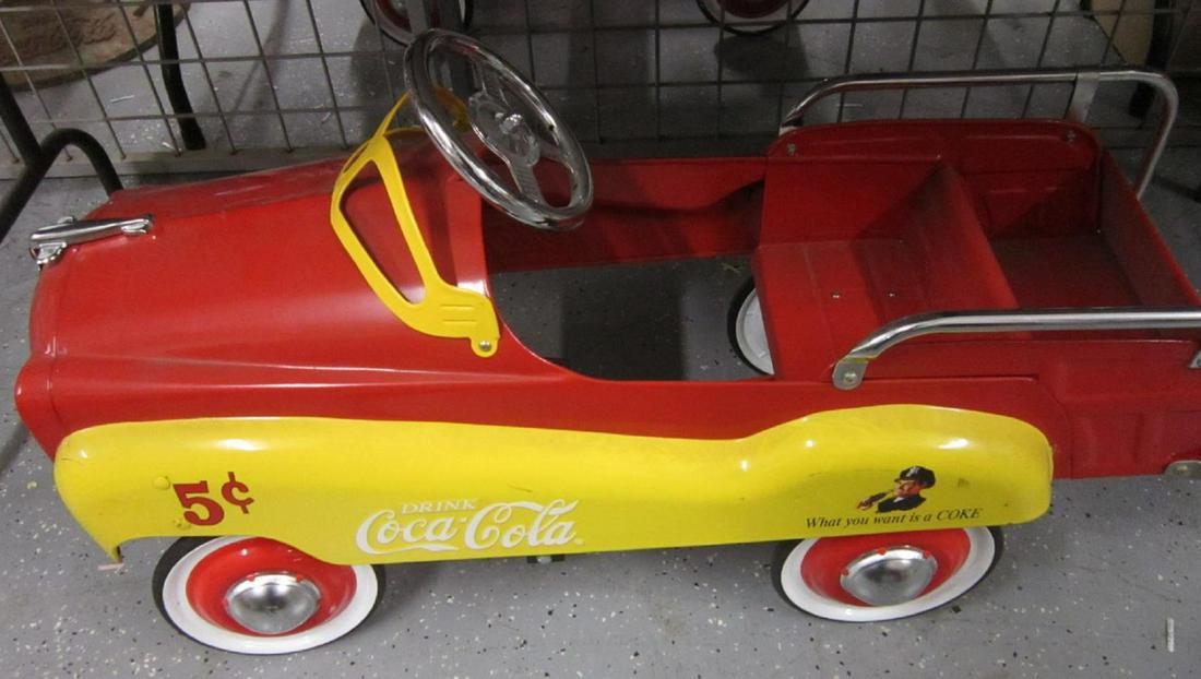 Coca-Cola 2 Tone Pedal Car: Coca-Cola 2 two Tone Pedal Car, in red and yellow, 5¢ and and Policeman drinking Coke embellishments, tailgate, late 20th C, 40" length. CONDITION: Like new, small ding on rear fender, couple rubbed 