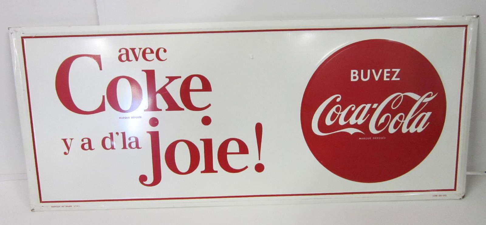 Vintage Canadian Tin Coke Sign: Vintage Canadian Tin Coke Sign in French "Avec Coke y ad'la joie! (with Coke There is Joy!, with red Coca-Cola button on right Buvez Coca-Cola - Marque deposee" (Drink Coca Cola - brand mark) fabrique