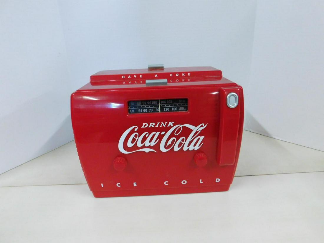 Coca-Cola AM/FM Cassette Radio: Coca-Cola AM/FM Cassette Radio, ice cooler form with volume and tuning knobs on front, "Drink Coca-Cola" in raised white lettering, "Have a Coke" on lift lid with inner cassette tape player and tape s