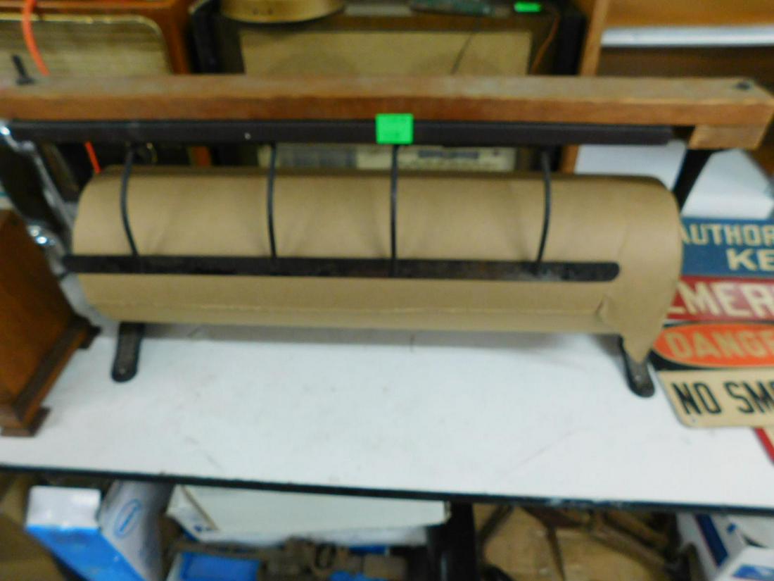 Antique Paper Roll Cutter: Antique Paper Roll Cutter, "The Pioua" cast iron side supports, hinged metal cutter, wood top; includes paper roll, 19th / 20th C, 28 1/2" x 14" x 7". CONDITION: Good working used condition, slight ru