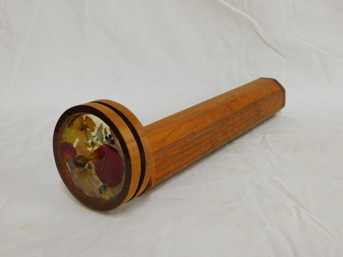 Teakwood Octagon Barrel Kaleidoscope: Teakwood Octagon Barrel Kaleidoscope, with twin dry flower filled disks, barrel 2"d, length 13".[15] CONDITION: Very good.