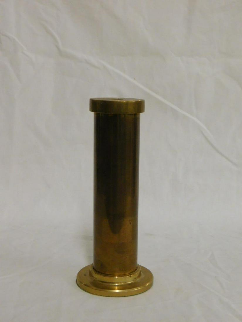 Brass Vertical Standing Kaleidoscope: Brass Vertical Standing Kaleidoscope, cylindrical form with stepped circular foot, 6 1/4" length.[16] CONDITION: Very good.