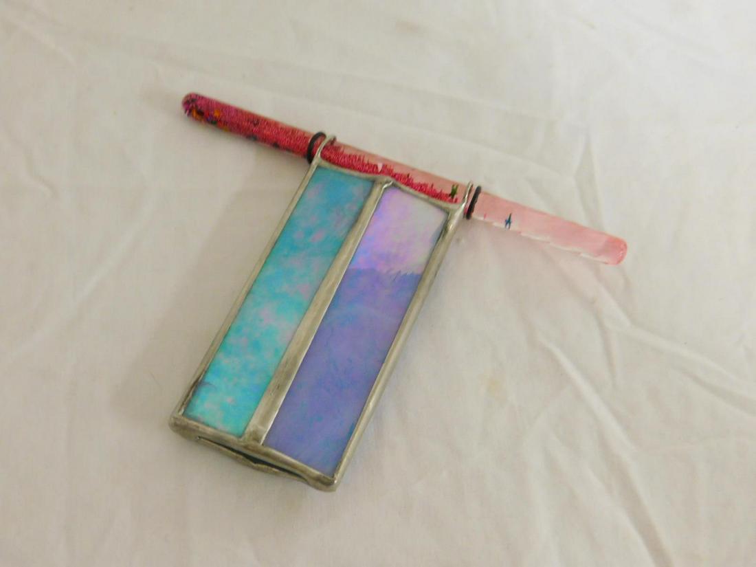 Small Slag Glass Kaleidoscope: Small Slag Glass Kaleidoscope, blue glass with lead fittings and a fluid and sequin filled lucite tubes, 6" x 5" x 1/2". [31] CONDITION: Very good.