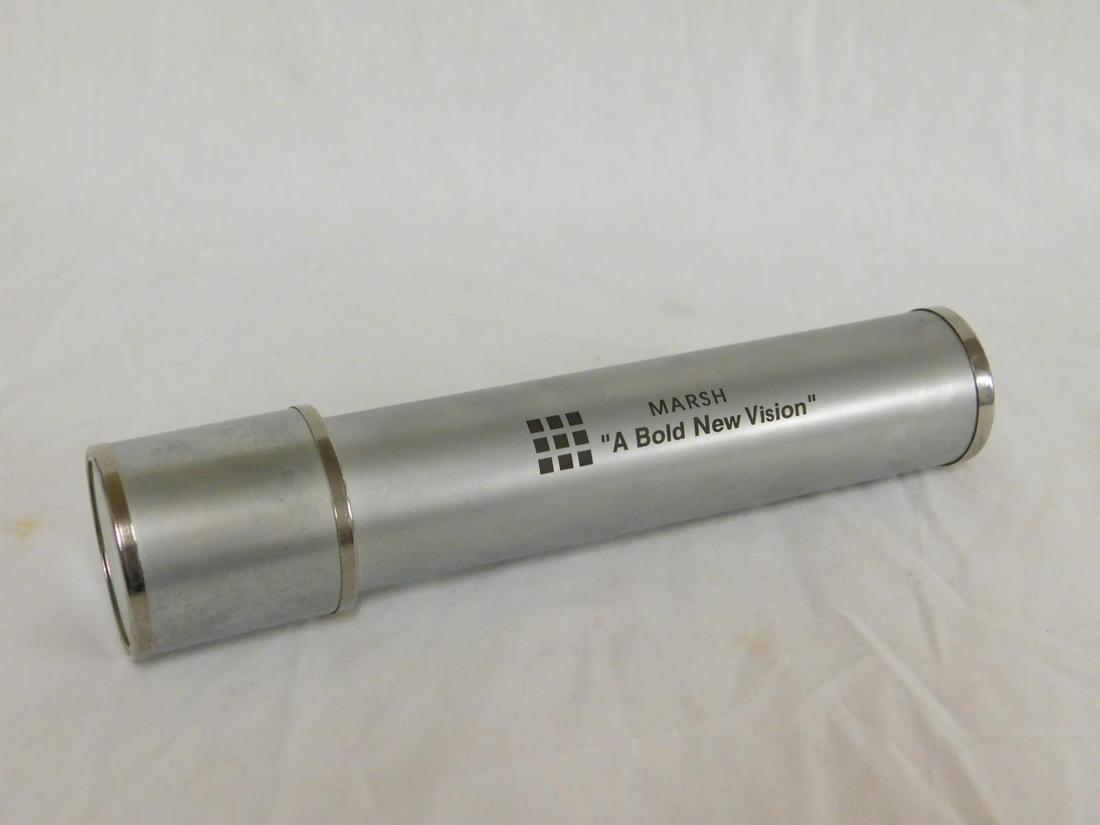 Silvered Metal Telescope Form Kaleidoscope: Silvered Metal Telescope Form Kaleidoscope, chromed fittings, marked, "Marsh A bold New Vision" in black, length 8".[13] CONDITION: Very good.