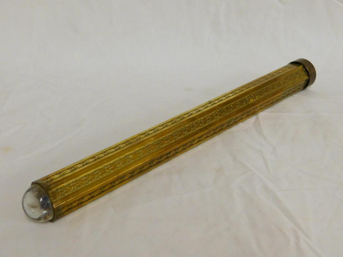 Engraved Brass Kaleidoscope: Engraved Brass Kaleidoscope, six sided with foliate engraving, lucite convex end, length 12 1/2".[9] CONDITION: Very good, crazing to convex end.