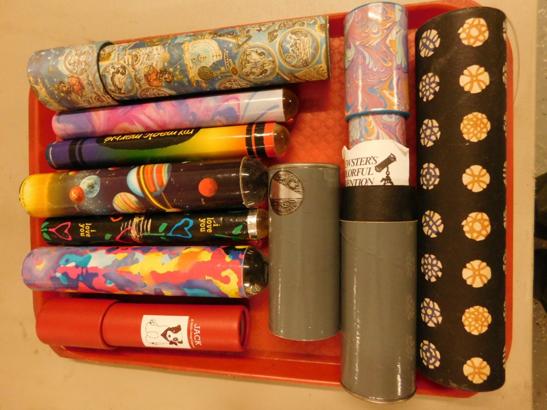 9 Kaleidoscopes: 9 Kaleidoscopes, all cylindrical, 5 with Lucite domed ends, from 8" to 10". [49] CONDITION: Very good, used condition.