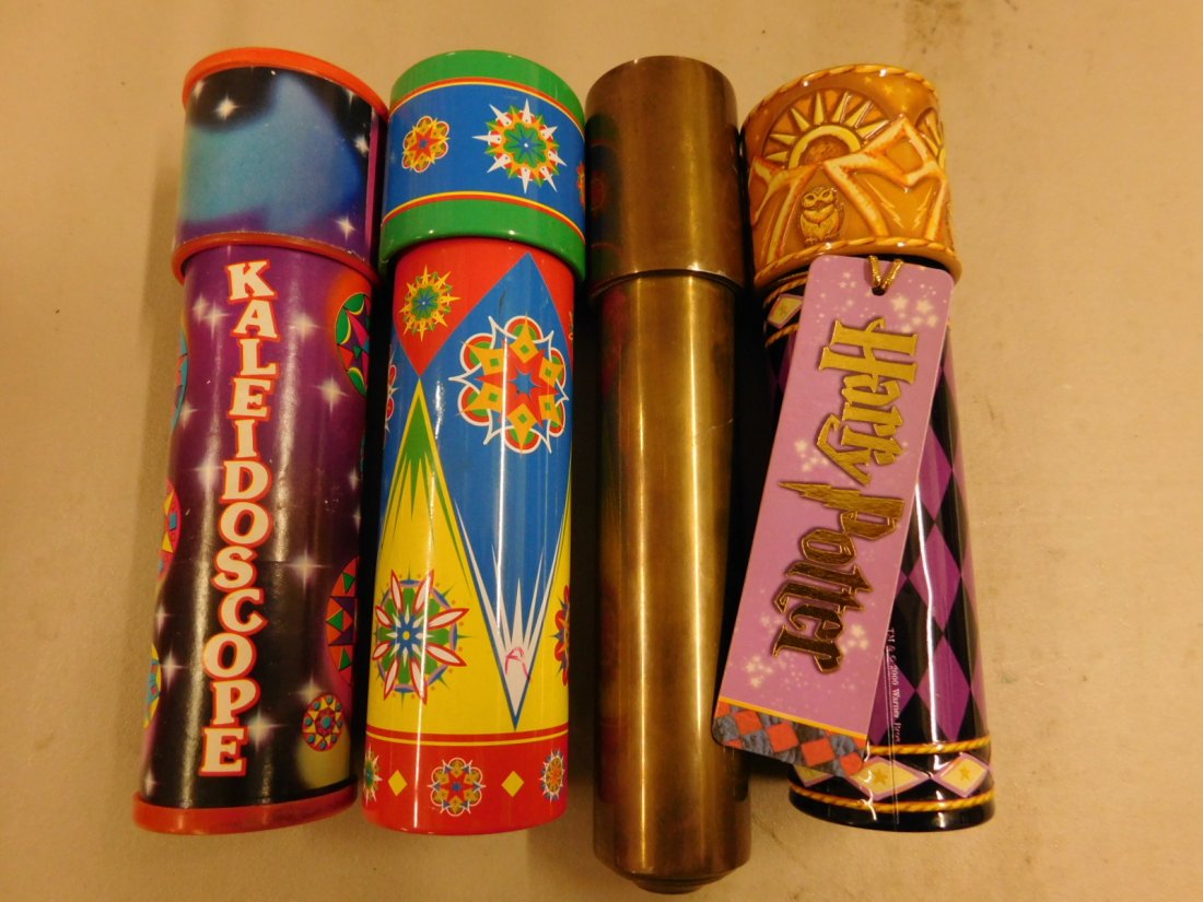4 Kaleidoscopes: 4 Kaleidoscopes includes: 8 1/4" brass and three decorated 7" metal, Harry Potter, etc. [50] CONDITION: Very good, used condition.