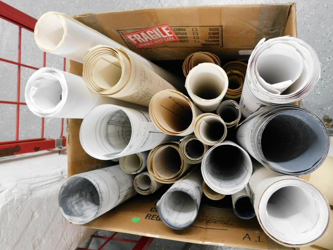 Box lot Contemporary Train Plans and Drawings: Large box of train-related rolled material, most late 20th century, comprising blueprint reprints, model railroading plans, train station designs, and mechanical diagrams. Most on paper, some vellum /