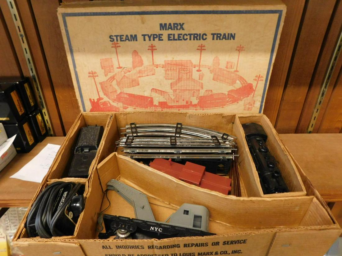 Marx Train Set: Marx Train Set, Steam type electric, engine No. 400 with NYC tender, gondola, crane car, caboose, No. 309transformer, 3 telegraph poles, original box. CONDITION: Fair, used condition, engine wheel mec