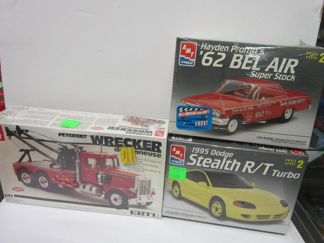 3 Ertl / Amt Scale Vehicle Models: 3 Ertl / Amt Scale Vehicle Models, all new (factory sealed) in original boxes including: Peterbilt Wrecker de'paneuse (tow truck), 1:43 scale, #6701, plus 1995 Dodge Stealth R / T Turbo, #6543 and Hay