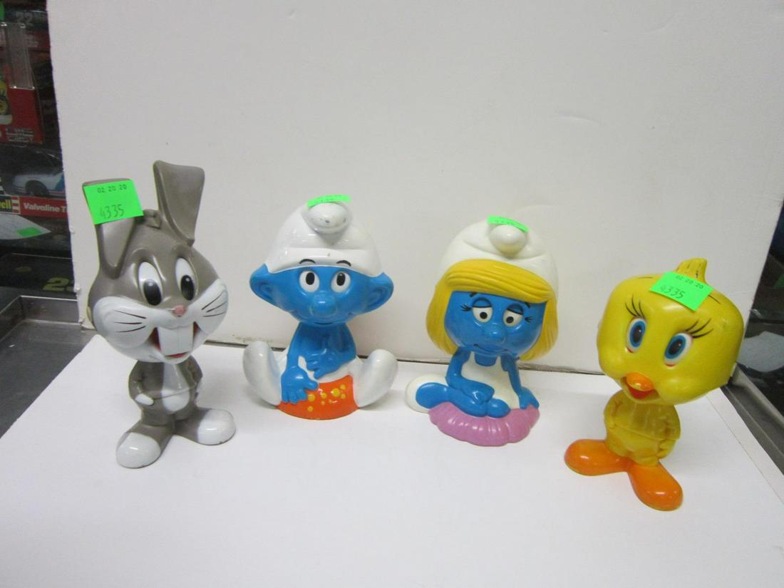 4 Vintage Chatter Chum String Pull Toys: 4 Vintage Chatter Chum String Pull Toys including: two Wallace Barrie & Co., Payo 1983 Smurf & Smurfette, 7 1/4" h, each and two Mattel 1976, Bugs Bunny 7 3/4"h with Tweety Bird, 7" all with plastic r