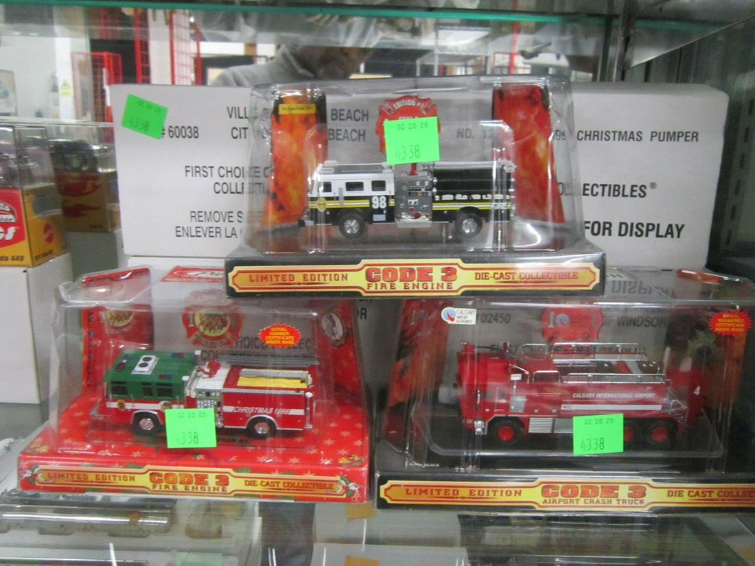 7 Code 3 - 1:64 Scale Fire Engines: Seven Code 3 - 1:64 Scale Fire Engines, all new in original plastic cases including: Edition #1, (#98), Calgary International Airport (#4), (2) Village of Windsor ladder trucks (#1 - red and #10 yello