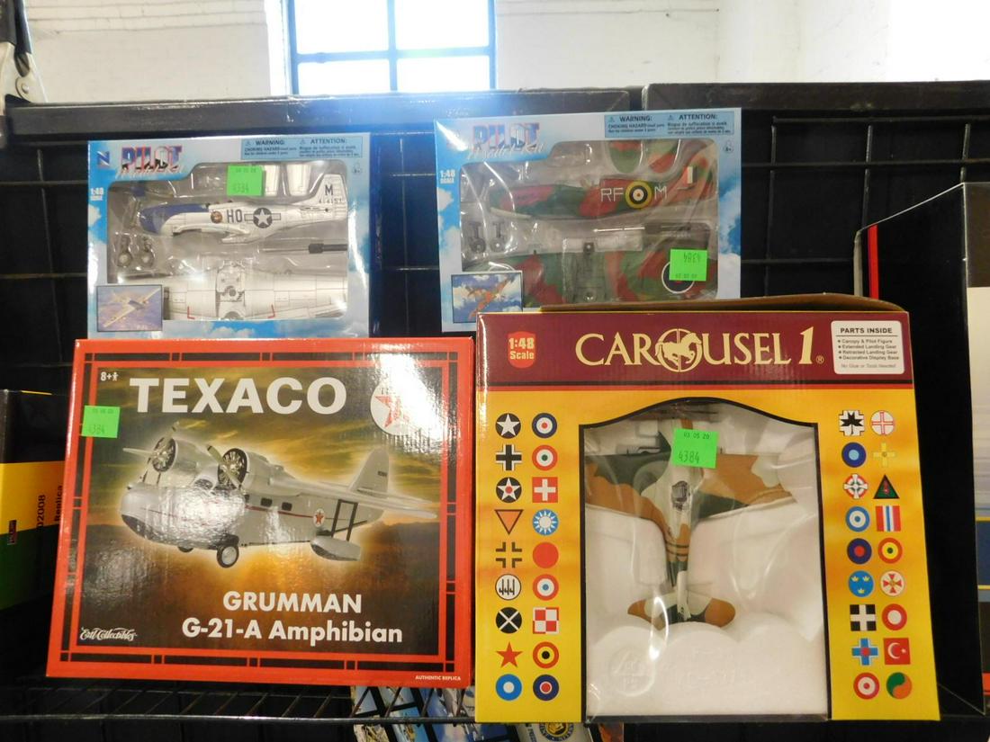 4 Assorted Diecast Planes: No issues identified., all new in original boxes, small scale diecast including: Carousel 1, P36C Hawk, #6122, 1"48 scale, Ertl Collectibles Grumman G-21-A Amphibian, 21938P, plus two Pilot Model Kit,