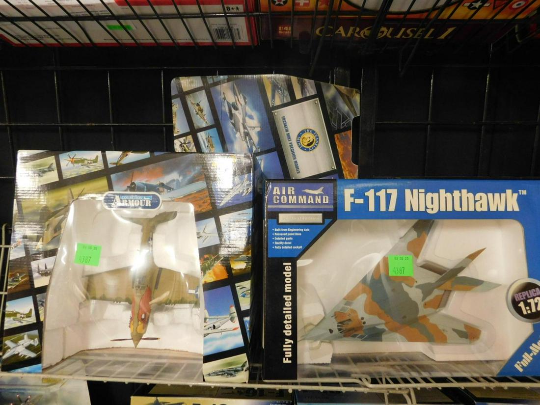 2 Diecast Planes NIM: 2 Diecast Planes, both new in box, small scale diecast including: Franklin Mint Armour CollectionP40N RARPot Head, B11E377 and Air Command, F-117 Nighthawk, No. 19005,1:72 scale. CONDITION: No issues 