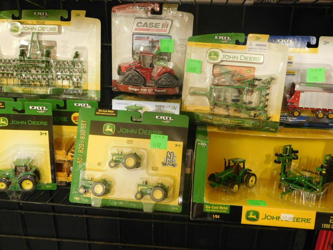 Ertl Die Cast Farm Vehicles John Deere: Ertl Die cast Farm Vehicles, John Deere all new in original boxes and packages, small scale die cast including: 8220 tractor with 1900 CCS Air Seeder, T 8020 Harvester and Wagon, 8530 tractor, 4930 Sp