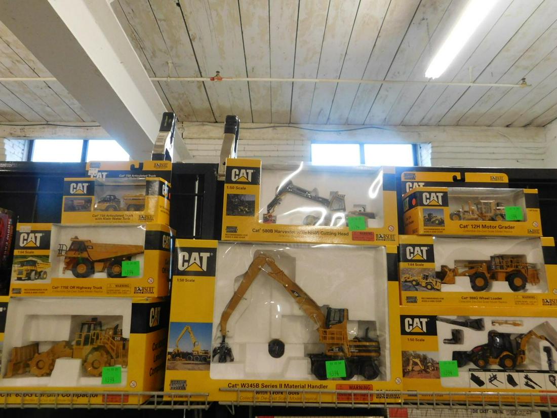 8 Norscot Cat Vehciles: 8 Norscot Cat Vehciles, all new in original boxes, small scale diecast including: 420E Backhoe Loader, 9986 Wheel Loader, 1211Motor Grader, 580B Harvester, W345B Material Handler, 730 Articulated Truc