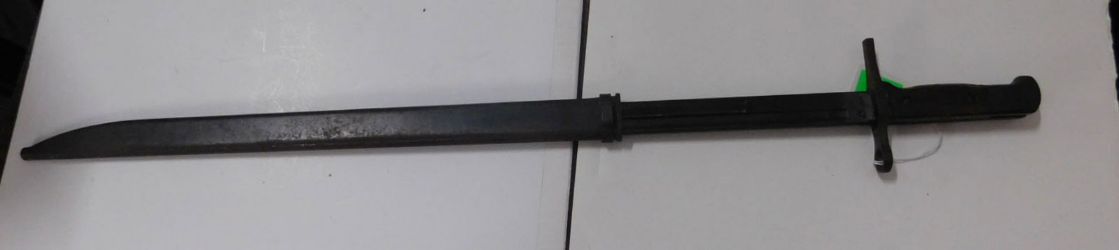 WW II Japanese Bayonet with Scabbard: WW II Japanese Bayonet with Scabbard, type 30, wood grip, length 20 3/4". [27] CONDITION: Very good, small wood loss area on grip, slight pitting on greased blade and pommel, expected wear on scabbard