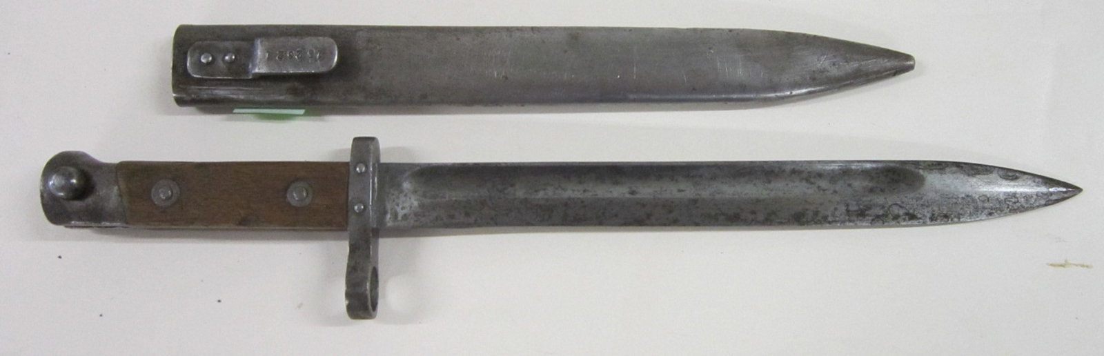 Czech Republic Bayonet w/Scabbard: Czech Republic Bayonet w/Scabbard, wood grip with serial number 324776; scabbard with serial number 102021, length 14 3/4". [25] CONDITION: Mild rust, ding and wear to scabbard, black tarnish marks on