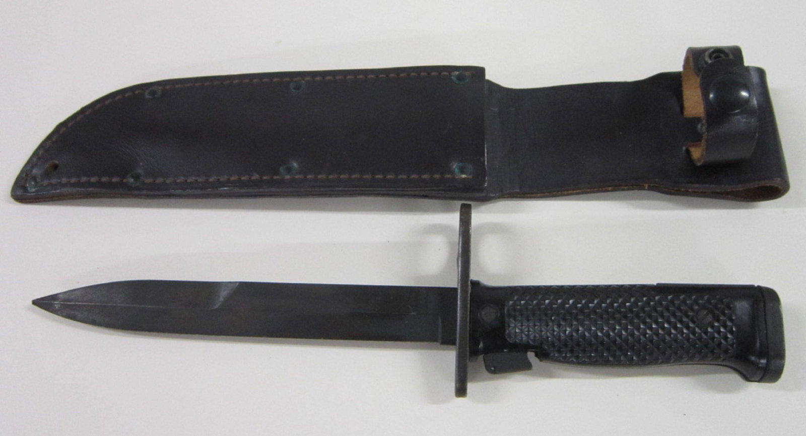 Vietnam Era Bayonet: Vietnam Era Bayonet, US M6 Imperial, for M14 rifle, circa 1957, no scabbard, in fitted leather holder, 12 1/2"l. [26] CONDITION: Very good, some rust on guard.