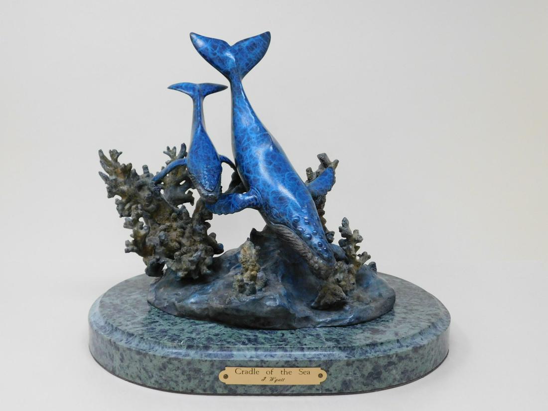 J. Wyatt - Bronze - "Cradle of The Sea": "Cradle of The Sea", No. 767 / 950, two tone patina, green marble base, depicts mother whale and calf diving in a coral sea, includes: certificate of authenticity 10" x 11" x 9". CONDITION: Very good,