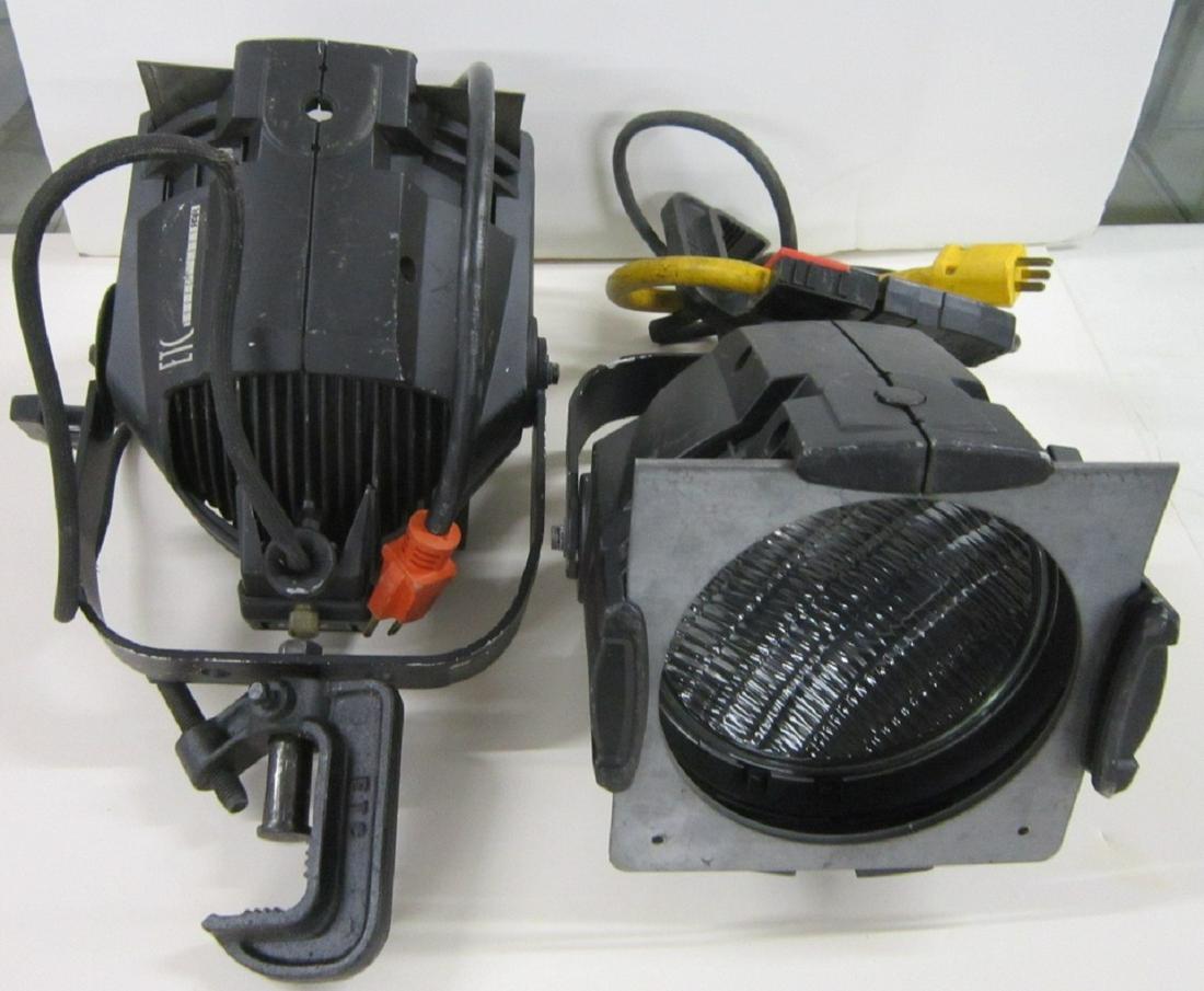 Pair of ETC Source Four PAR Spot Lights: Pair of ETC Source Four PAR 750 W. spot lights, both with clamp end to attach to bar, both have electric plug attachment (to cord coming from light) and light filter frame (no filter), 8 1/2" x 8 1/2"