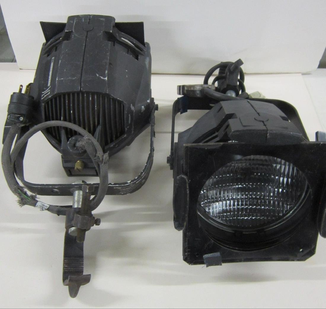 Pair of ETC Source Four PAR Spot Lights: Pair of ETC Source Four PAR 750 W. spot lights, both with clamp end to attach to bar, both have electric plug attachment (to cord coming from light) and light filter frame (no filter), 8 1/2" x 8 1/2"