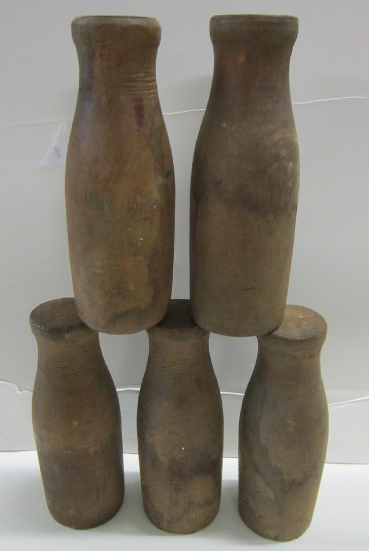Carnival Milk Bottle Ball Toss Game: Carnival Milk Bottle Ball Toss Game, set of five natural wood finished turned wood, 8" high bottles with drilled holes in bases for dowel insertion to prevent being knocked over, early 20th C. CONDITI