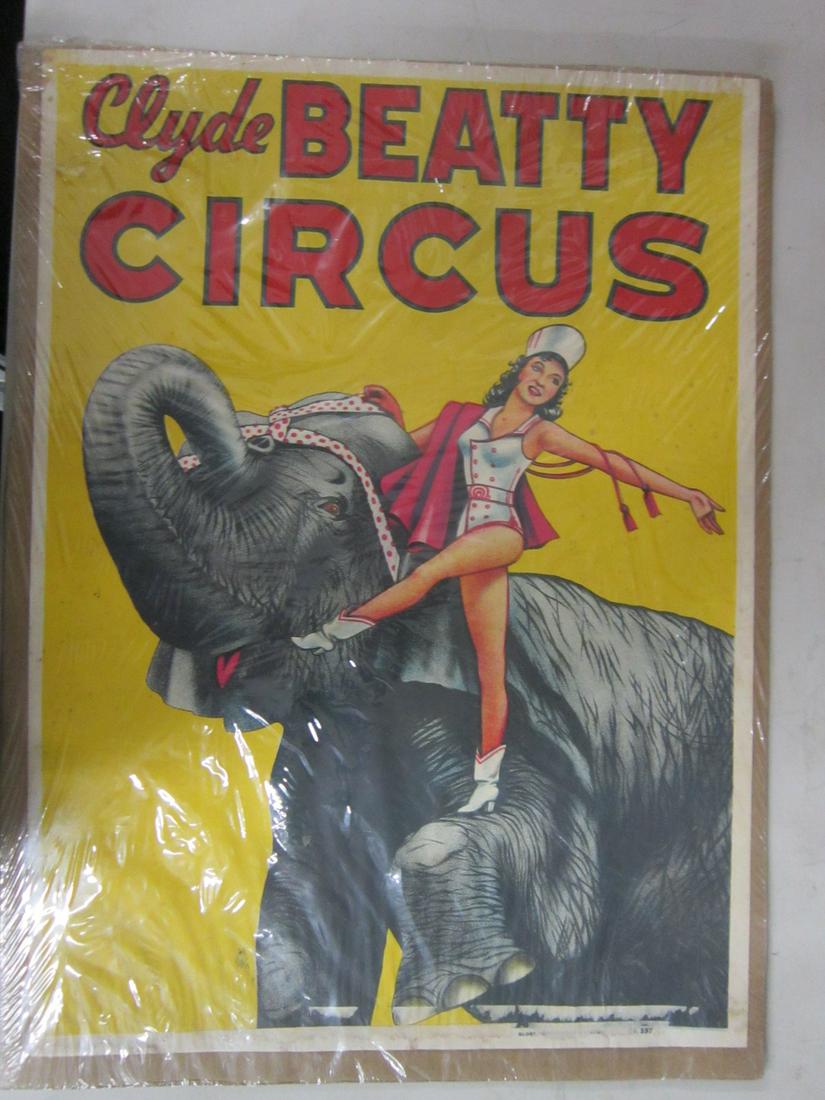 Original Clyde Beatty Circus Poster: Original Clyde Beatty Circus Poster, one sheet litho on paper, woman on elephant, globe poster, S.F. 597, 20 1/2" x 28', behind plastic. CONDITION: Paper Fair Poster residue along bottom of poster, so