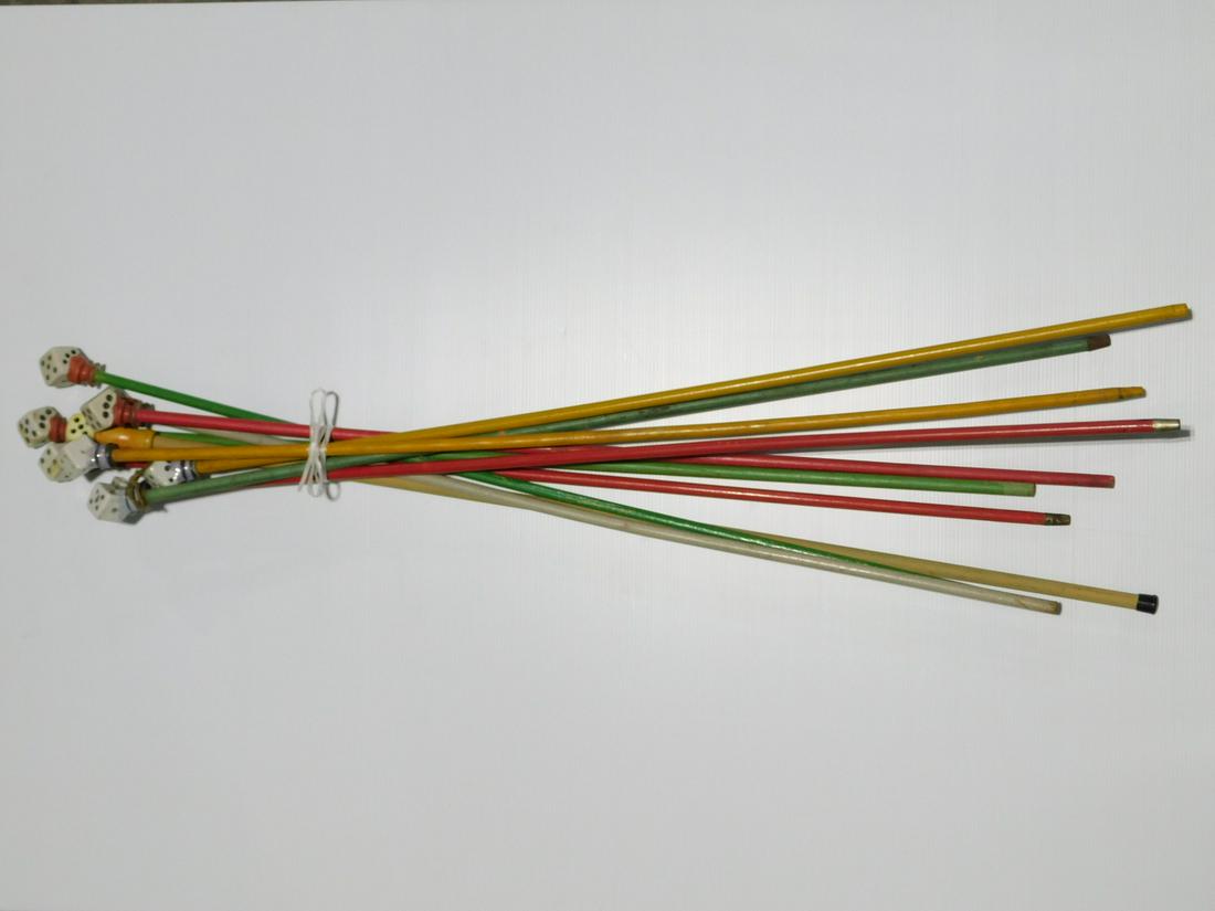 10 Carnival Dice Theme Canes: Ten Carnival Dice Theme Canes, nine with porcelain dice handles, one with plastic dice handle, some marked Japan, all with painted wood shafts, three with metal ferrules, early to mid 20th C. CONDITIO