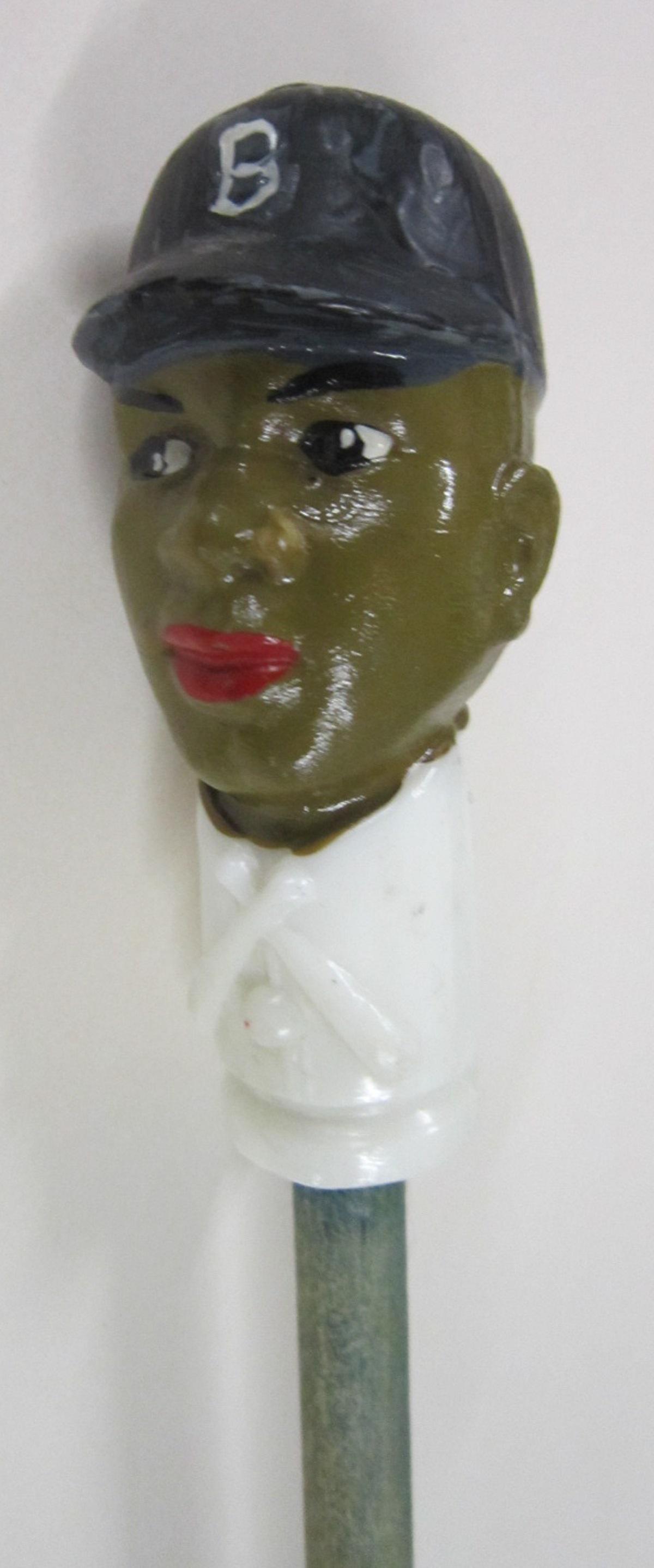 Rare Jackie Robinson Souvenir Cane: Rare Jackie Robinson Souvenir Cane, Brooklyn Dodgers, painted hard plastic souvenir cane head, 3 1/4" atop wood carnival cane, 35" overall length, this is an example of one of the first important Afri