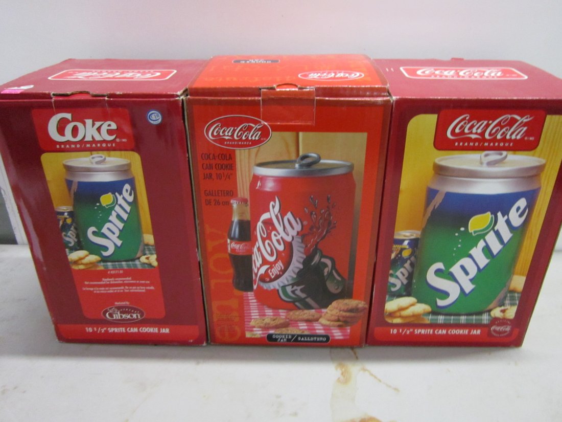 3 Coca Cola & Sprite Cookie Jars: 3 Coca Cola & Sprite Cookie Jars including; (2) Sprite can, 10 1/2" and (1) Coca Cola can, 10 1/4" all like new / new in original boxes, 7 1/2" x 7 1/2" x 12" ea. Condition; like new / new, boxes may 