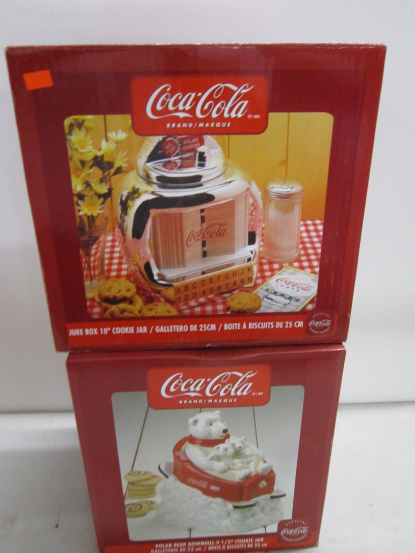 2 Coca Cola Cookie Jars: 2 Coca Cola Cookie Jars, both like new in original boxes including; Polar Down Hill, 9 1/2" and Juke box, 10". Condition; boxes may have some minor wear