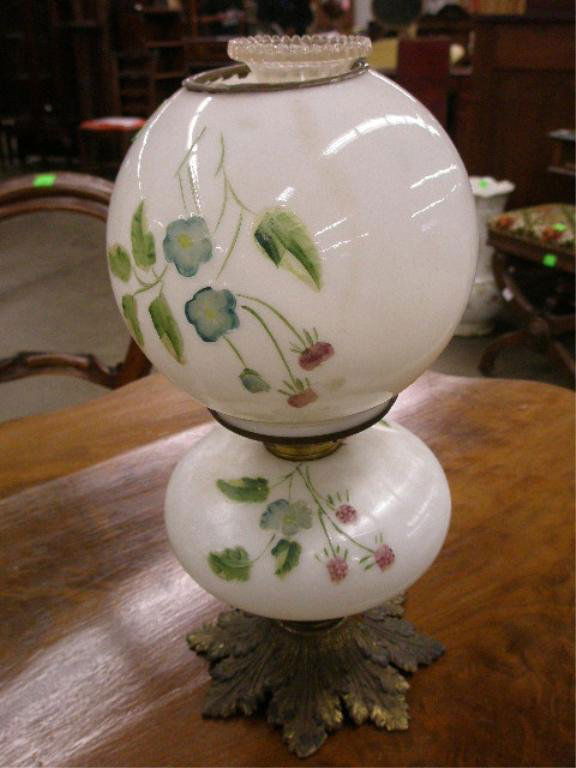 Small Gone With The Wind fluid lamp: Small Gone With The Wind fluid lamp, low relief blue & green floral embossed milk glass shade & font, late 19th C. hgt 15", diameter 7"