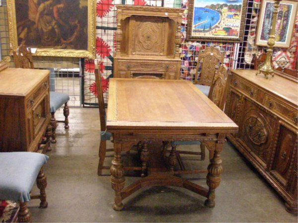 Jacobean style 9 pc dining room set: Jacobean style 9 pc dining room set, Oak, baluster turned legs, overall foliate & mixed bordered carvings, includes: draw leaf table, 5 chairs, china closet, sideboard, server, early 20th C.