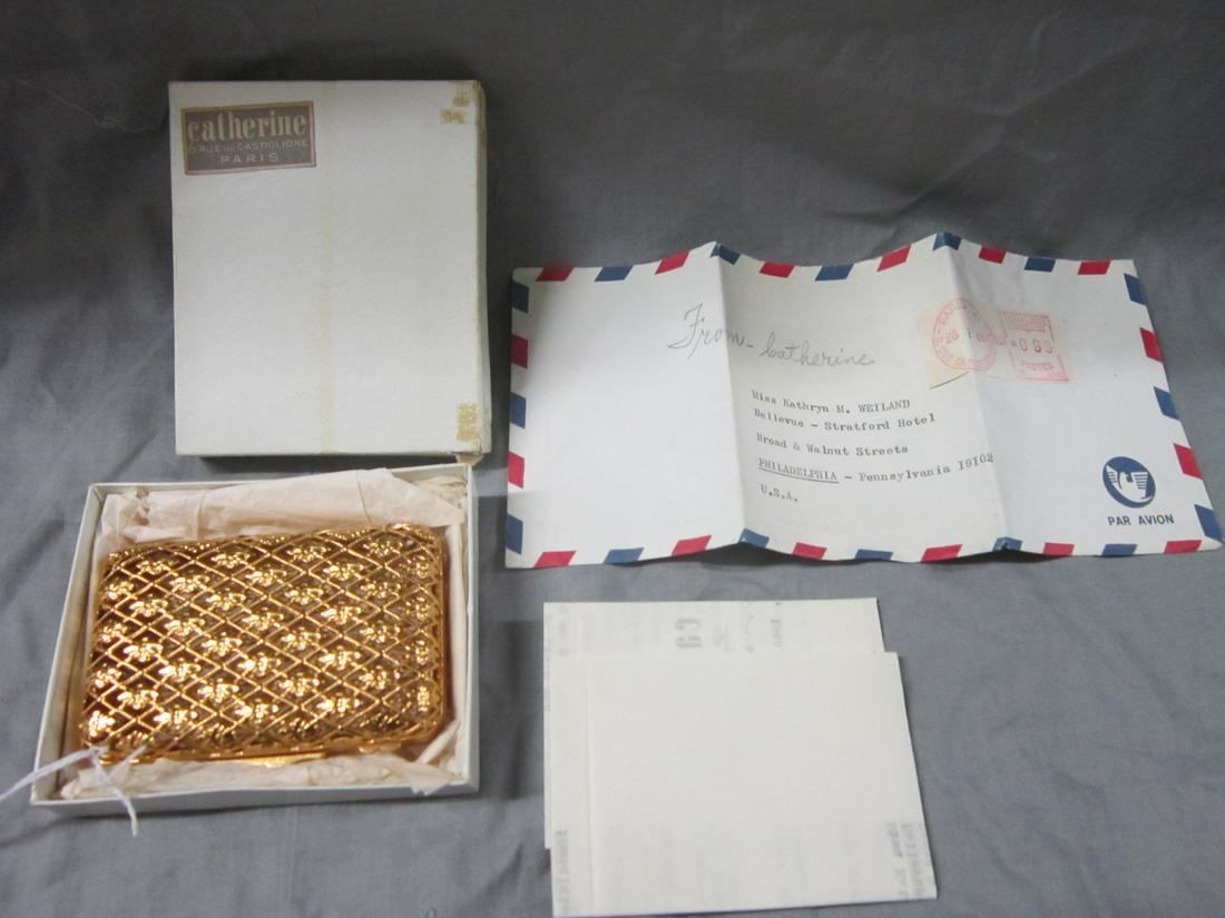 Gold Tone Parisian Cigarette Case: Gold tone Parisian cigarette case "Made in France", gold filled lattice and rosette mesh hinged case. 3 5/8" x 2 1/2" x 3/4", includes: letter from Paris retailer and original box. CONDITION: Like new