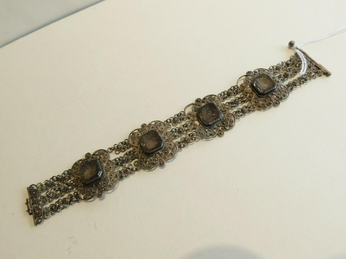 800 Silver & Venetian Glass Intaglio Bracelet: 800 Silver & Venetian glass Intaglio bracelet gold washed, scroll filigree wire & rosette motifs with 4 octagonal bezels holding Venetian glass Intaglio Portraits of Royals, length 7 1/4", width 1 1/4