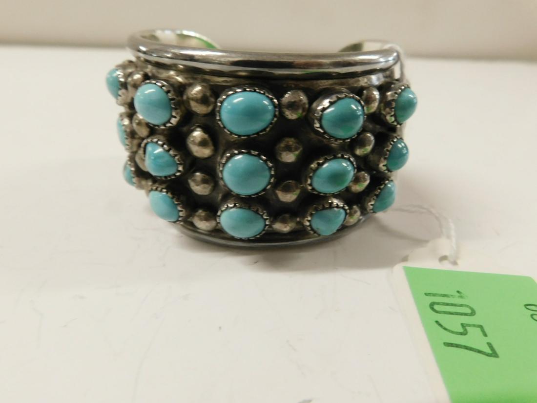 Leo Coriz Sterling & Turquoise Bracelet: Leo Coriz Sterling & Turquoise Bracelet, Kewa Pueblo (Santo Domingo), 1913 - 1997, master jeweler, Tufa cast cuff bracelet, features five rows of three cabochon turquoise in bezel sets alternating wit