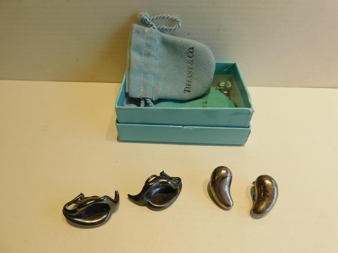 2 Pair Tiffany Elsa Peretti Sterling Earrings: 2 pair Tiffany Elsa Peretti sterling earrings includes; teardrop 21mm length; and molded leaf form 30mm length;clip backs, includes 2 blue pouches and one box and a box of Tiffany jewelry cleaner. [20