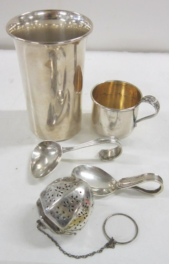 Sterling Silver 5 Piece Group: Sterling Silver 5 piece group including; 4 1/4" h. tumbler (engraved Elizabeth), Whiting & Co., 1 3/4" h. child's cup (engraved Eugene) with a fancy floral cast handle, 3 1/4" Webster bent handle chil