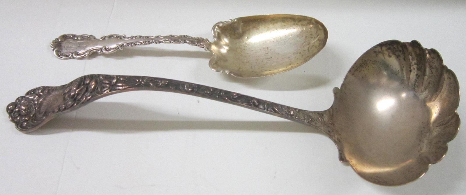 Mauser Sterling Silver Punch Ladle: (2 pieces) Mauser Sterling Silver Punch Ladle: A Mauser Manufacturing Co sterling silver punch ladle in a repousse style rose pattern. monogrammed on handle; 12.5" long. Along with a Whiting sterling 
