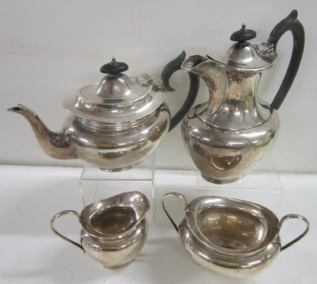 English Sterling 4 Piece Coffee & Tea Set: English Sterling 4 Piece Coffee & Tea Set, Sheffield sterling silver, 1932 E.V. (E. Viners) maker's mark, ovoid melon form bodies, loop handles, coffee and tea pot with elongated wood handles and fini