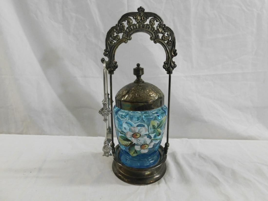 Victorian Pickle Caster: Victorian Pickle Caster, hand blown blue glass inverted thumbprint glass caster with enameled dogwood flowers, rests in Waldorf quadruple plate stand with open work scroll and shell crest, and tongs, 