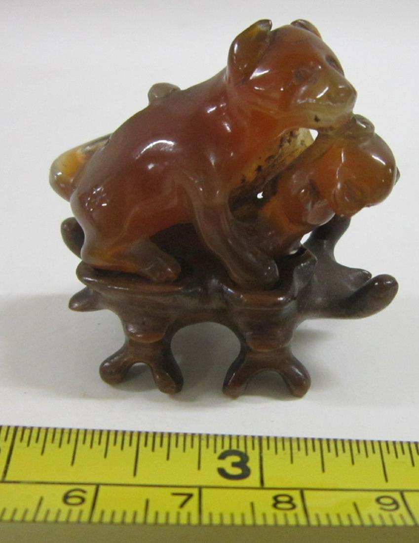 Chinese Carnelian Miniature Carving: Chinese carnelian miniature carving of a dog and her pup, 1 5/8" x 1 1/4" x 7/8", on a fitted rosewood stand, 19th / 20th c. Condition; very good, no issues noted
