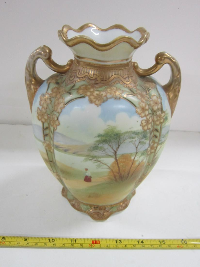 Nippon Porcelain Double Handled Vase: Nippon porcelain double handled vase, hand painted landscape panels with raised painted gilt and floral borders, Noritake M in wreath backstamp on bottom, 1890 - 1910, 8 3/8" h. [31] Condition; very g