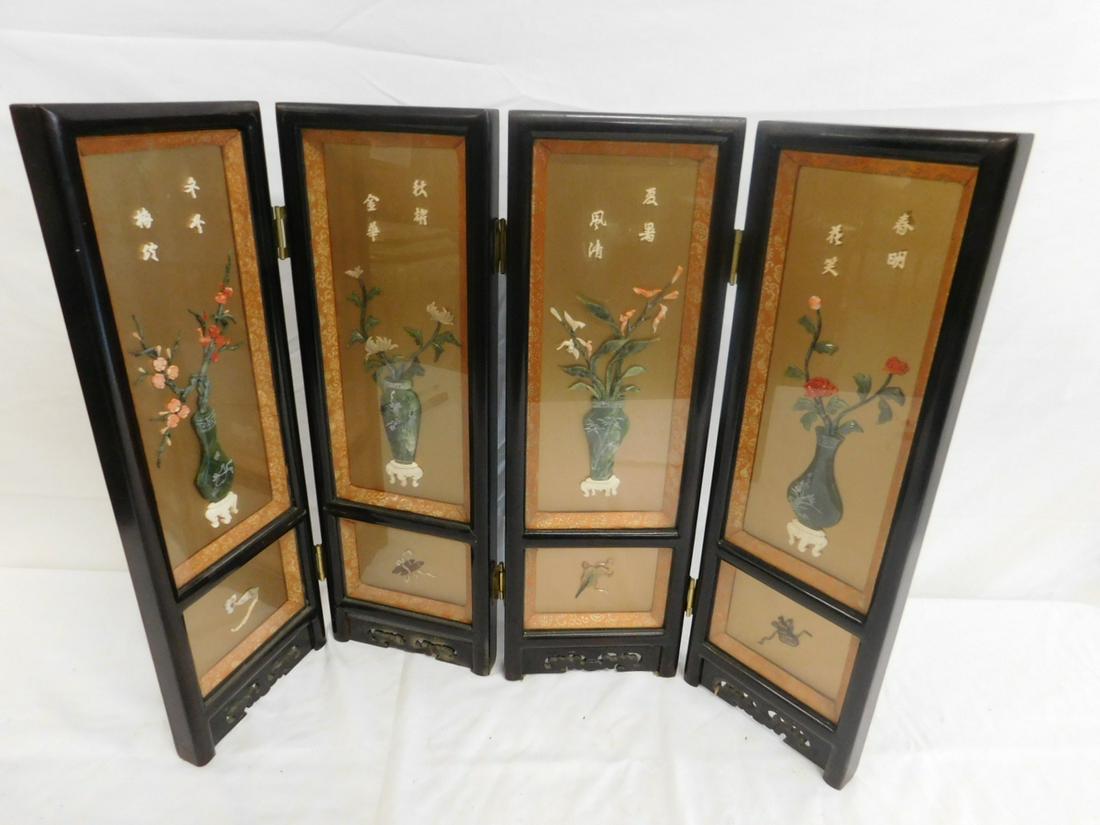 Chinese Four Panel Table Screen: Chinese Four Panel Table Screen; black and gold lacquer, glass-covered panels of applied hardstone in the form of floral urns, bone script, verso with painted plants. Mid 20th c. 24" x 18". CONDITION: