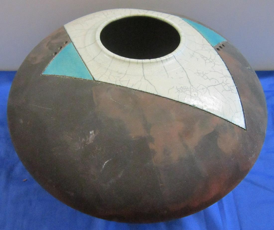 Russell Kagan Raku Pottery Vessel: Russell Kagan Raku Pottery Vessel: A hand-thrown earthenware vessel with incised, pierced and glazed decoration by studio pottery Russell Kagan. It was fired in the raku technique, which gives a livel