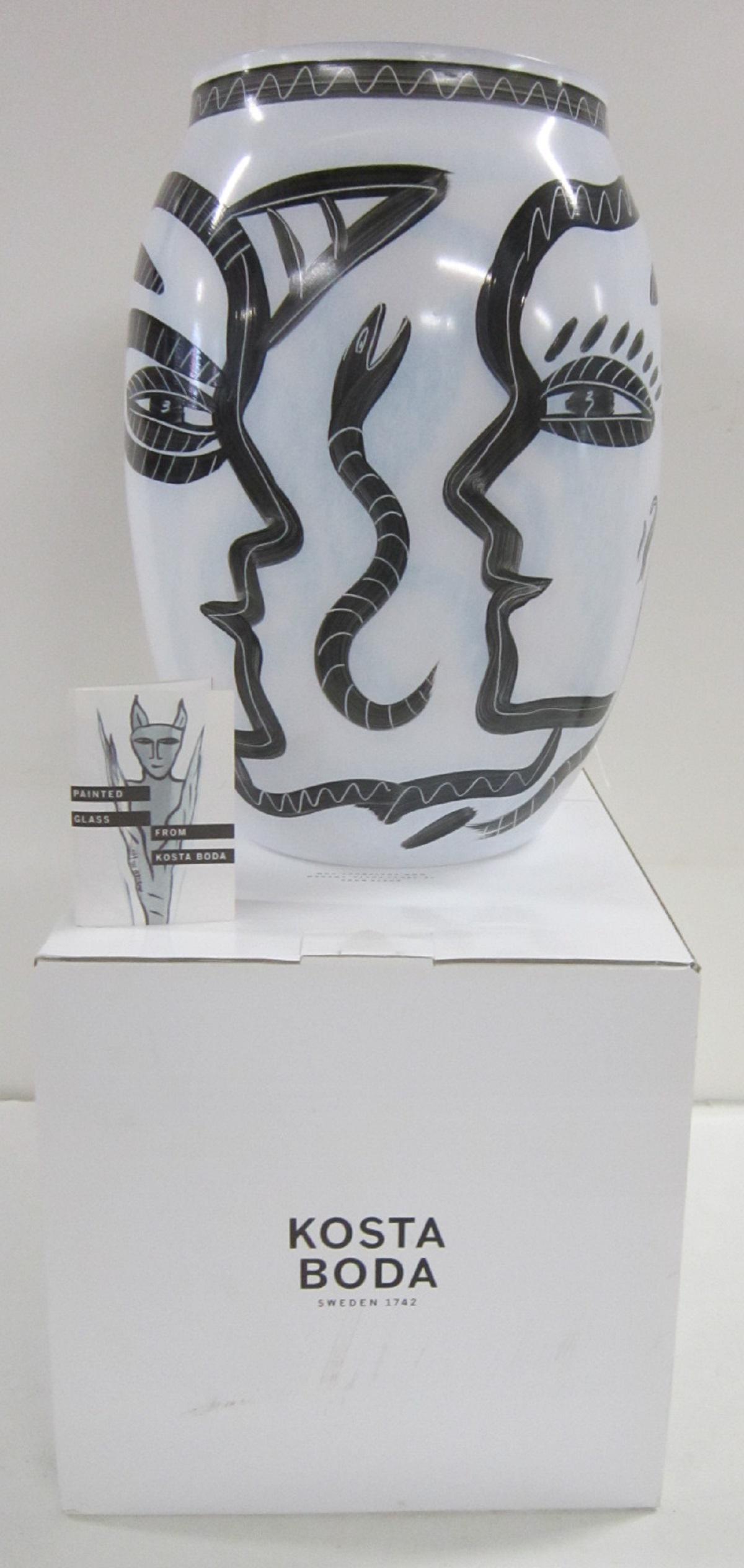 Monumental Kosta Boda Caramba Vase: An extremely large hand-painted vase designed by Ulrica Hydman-Vallien for Kosta Boda, in the "Caramba" line, decorated with snakes fish and foliate forms and a head in stark black on mottled white en