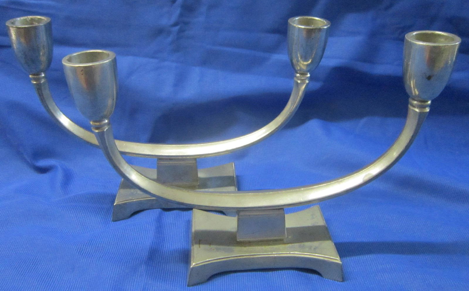 Pair Just Andersen Pewter Double Candlesticks: Pair Just Andersen Pewter Double Candlesticks: A pair of pewter double candleholders designed by Just Andersen (1884 - 1943) in a transitional Art Deco / Art Moderne style, consisting of a c-shaped fo